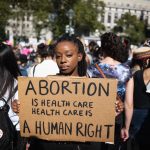 Abortion-human-rights-sign-scaled